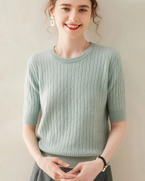 Woman brunching in the 100 % Cashmere Short-Sleeve Pullover, 19-micron Mongolian fibers and boxy cropped cut give luxe polish—your breathable 70-85 °F summer-to-fall staple.