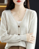 Woman layering a  Wool Knitted Casual Cardigan, 19.5-micron superfine Merino and relaxed drop-shoulders give nautical polish—your wind-proof 45-65 °F fall-through-spring essential.