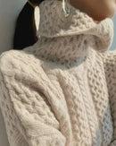 Cashmere turtleneck sweater, oversized cable-knit body, ribbed trims, storm-gray—luxury warmth for winter weekends or office layering.