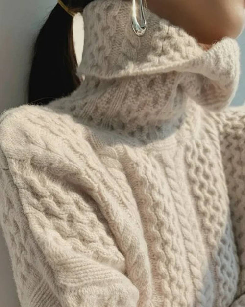 Cashmere turtleneck sweater, oversized cable-knit body, ribbed trims, storm-gray—luxury warmth for winter weekends or office layering.