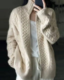 Winter-ready oatmeal wool cardigan coat with high stand collar and two-way zip—structured yet soft, perfect for cold-weather layering.