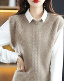 Woman layering an O-Neck 100 % Wool Sweater Vest, 19.5-micron superfine Merino drapes like jersey—your polished yet cozy 45-65 °F fall-to-spring layer.