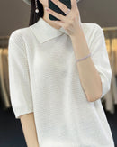 Women's loose-fit short-sleeve polo sweater made from soft [Material] featuring a classic collar and relaxed silhouette perfect for layering.