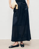 Women's loose-fit linen skirt made from breathable and featuring side slits, offering a comfortable silhouette perfect for summer fashion.
