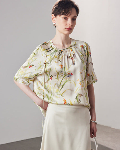 Stylish loose-fit silk t-shirt for women, designed with an intricate  print pattern and crafted from high-quality breathable mulberry silk for the spring and summer season.