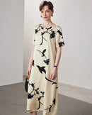 Spring and Summer short-sleeved silk dress featuring a vibrant floral print on a 19-mmi mulberry silk fabric with a relaxed straight fit.
