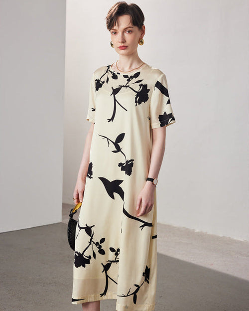 Spring and Summer short-sleeved silk dress featuring a vibrant floral print on a 19-mmi mulberry silk fabric with a relaxed straight fit.