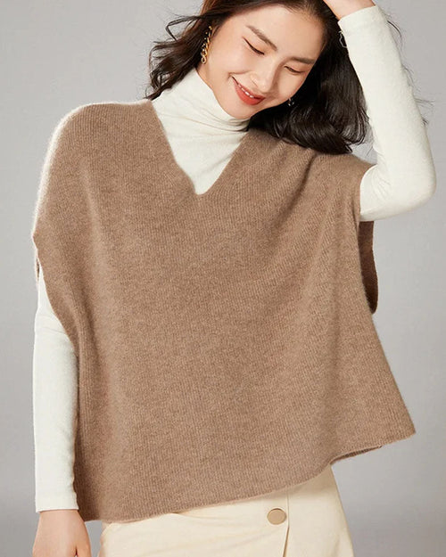  Woman layering the Oversized Wool Knitted Vest, 19.5-micron 100 % Merino rib and relaxed drop-shoulders give nautical polish—your wind-proof 45-65 °F fall-through-spring essential.