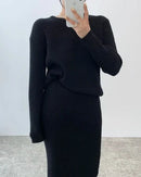 Woman brunching in a Ribbed Knitted Round-Neck Sweater & Midi Skirt Set, airy 55 % viscose / 45 % polyester rib drapes like jersey—your cozy yet polished 60-75 °F spring-fall statement.