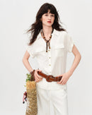 A loose-fit V-neck shirt featuring stylish rolled-up sleeves for a relaxed vibe. This comfortable top offers a breezy silhouette and soft drape, perfect for creating an effortless casual look during warm weather.