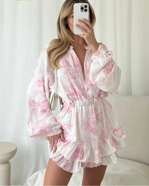 Cotton print mini dress with a round neckline, long sleeves, and empire high waist. A-line pleated silhouette in Brown, Pink, and Blue — loose & all-season.
