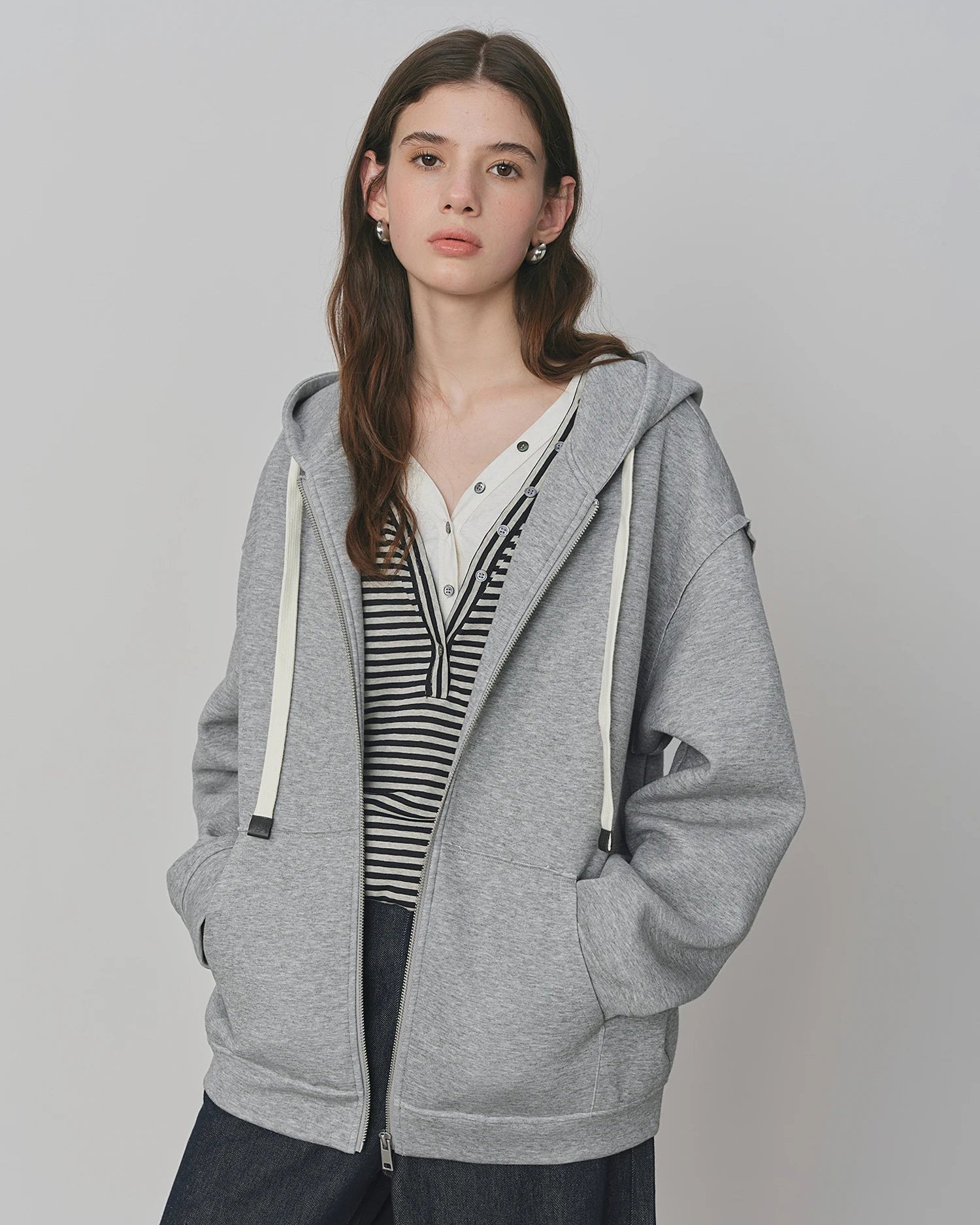 Premium loose fitting drop-shoulder hooded sweatshirt crafted for a cozy fit, offering a modern silhouette and versatile comfort for your lounging needs or daily activities.