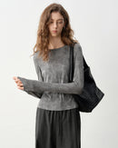 Women's dark grey polka dot crew-neck long-sleeved T-shirt, featuring soft rayon knit and medium stretch for effortless morning errands or evening outings versatility.