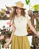 This sweet ribbed knit cropped button-down T-shirt with ruffled sleeves is made of 100% cotton with medium stretch and features a cropped polo collar and delicate embroidery. It's perfect for preppy summer casual wear or everyday women's wear.