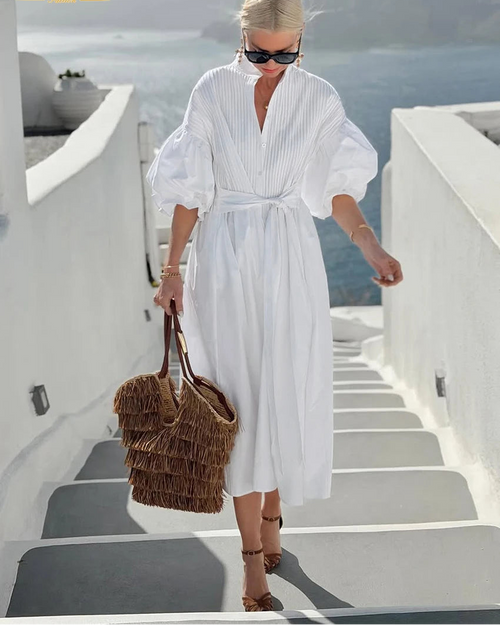 Cotton maxi dress with a V-neckline, delicate lace trim, and short sleeves. Loose A-line silhouette in white — breathable and effortlessly elegant for summer.
