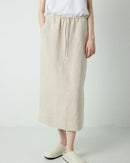 A flowy loose-fit linen A-line skirt featuring a comfortable tie waist. This breathable summer skirt offers a relaxed silhouette and natural linen texture, perfect for warm weather and creating a casual, effortless look.