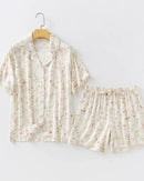 Women's Beige satin-like viscose short sleeve shirt and shorts pajama set featuring a delicate willow print, lapel collar, and silky smooth fabric, perfect for cool summer loungewear comfort.