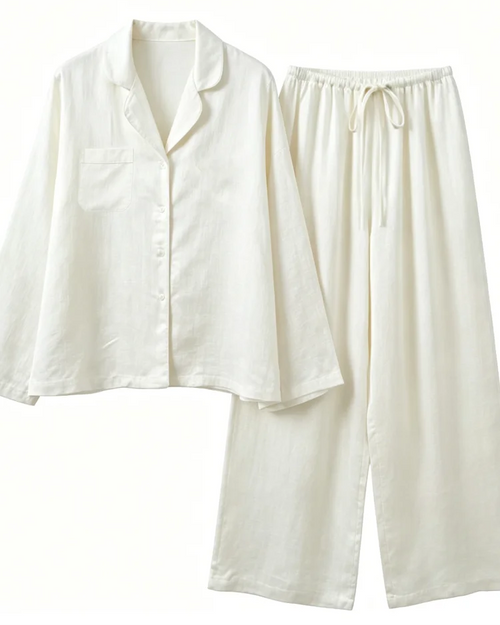 Our puff sleeve oversized shirt two-piece set featuring a turn-down collar top and elastic waist trousers. A relaxed, high-street co-ord designed.