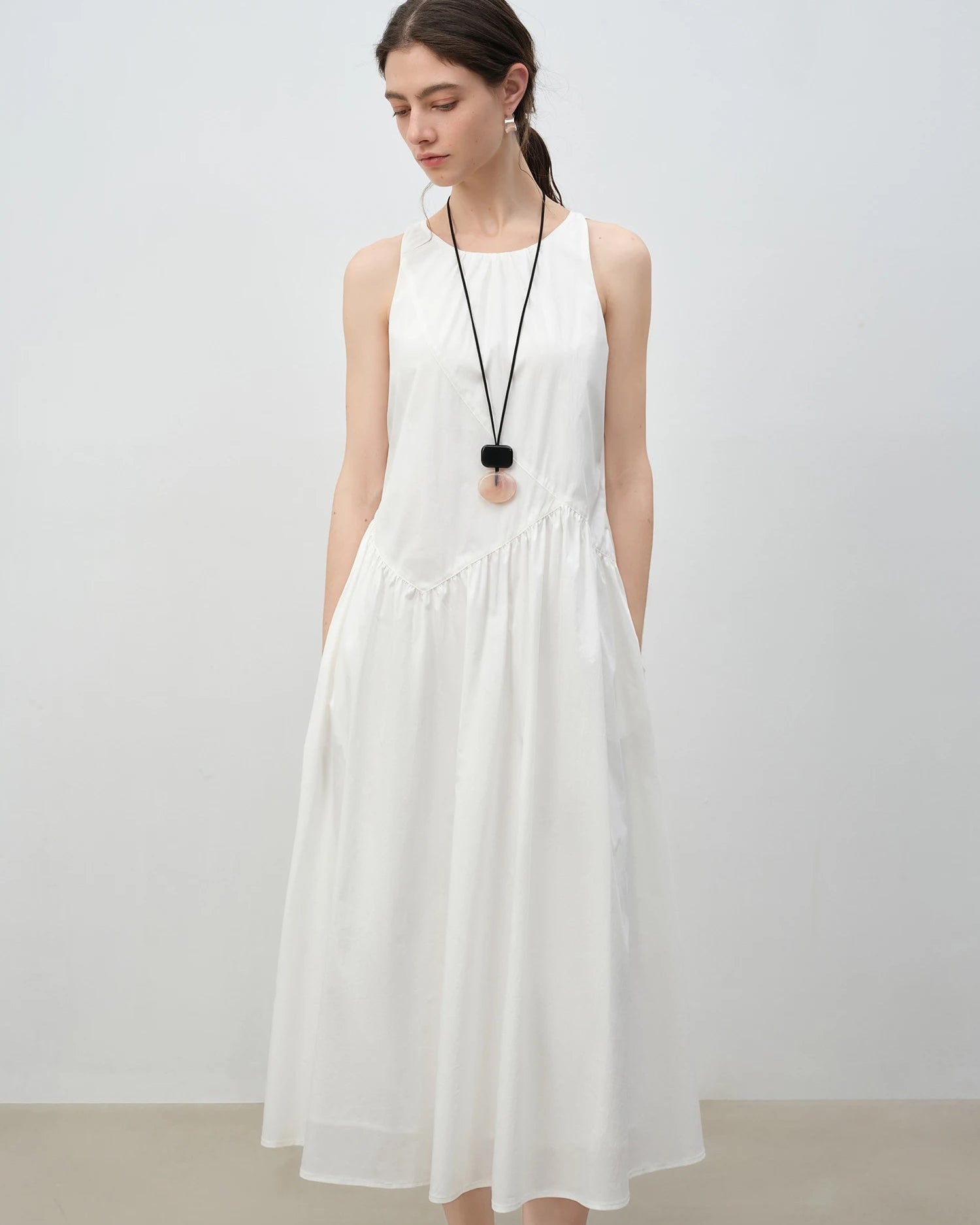 Women's Sleeveless A-line midi sundress crafted from soft cotton-stretch jersey, featuring a relaxed silhouette and midi length that delivers cool comfort for weekend brunches or seaside evenings.