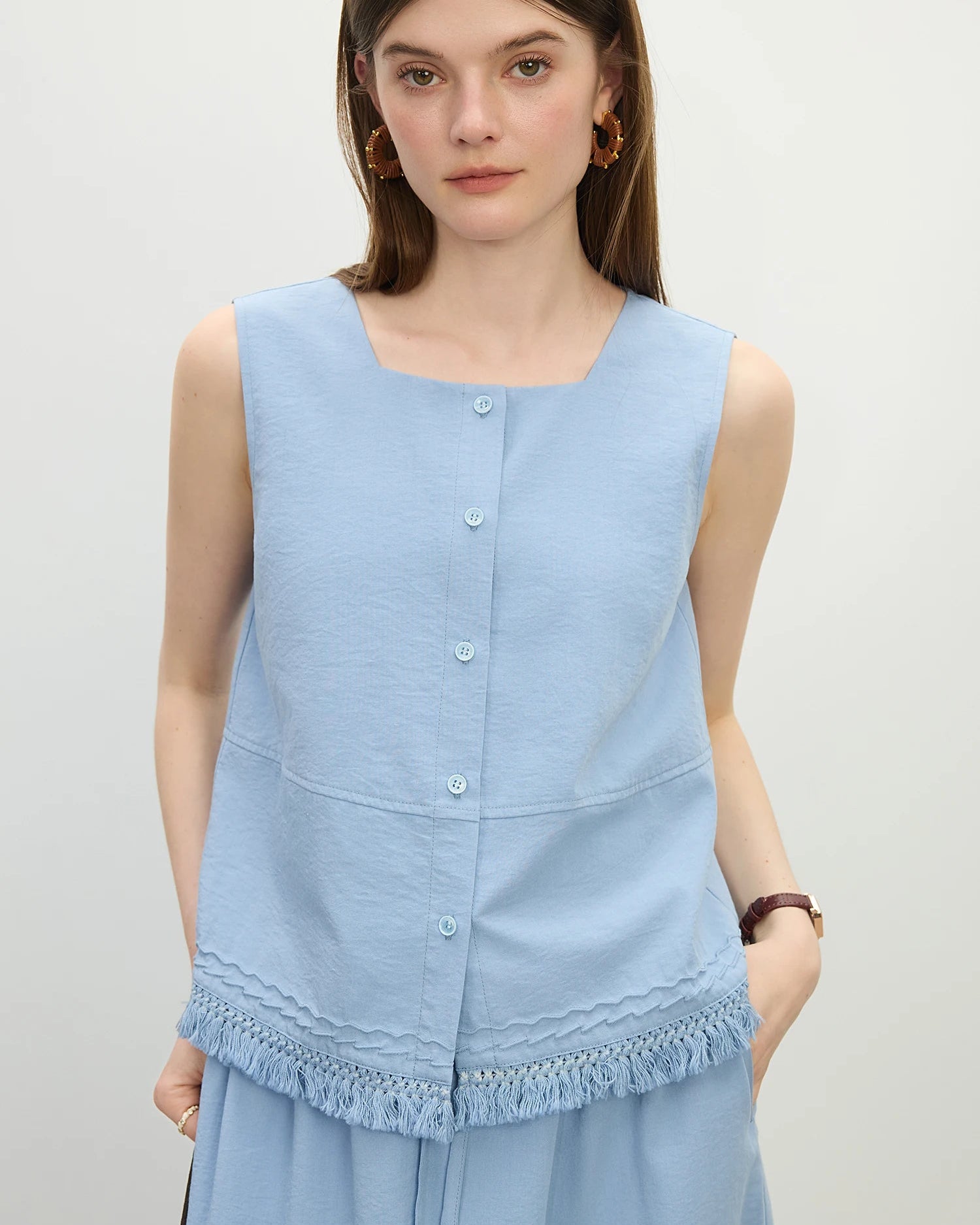 Premium blue square-neck knitted sleeveless vest crafted from a breathable viscose blend, offering a modern silhouette and versatile comfort for your lounging or daily summer activities.