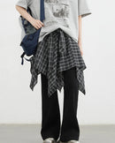 Plaid asymmetric A-line skirt in 100% cotton with elastic waist & tie detail. Classic British-inspired style for autumn & winter dressing.