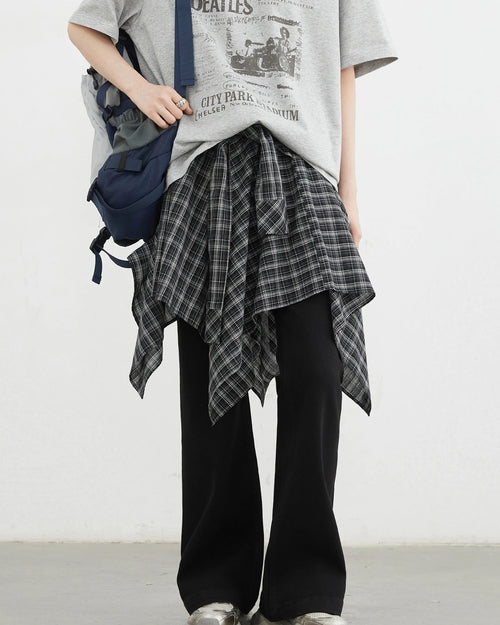 Plaid asymmetric A-line skirt in 100% cotton with elastic waist & tie detail. Classic British-inspired style for autumn & winter dressing.