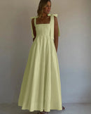 Cotton square neck maxi dress featuring an empire waist, pleated A-line skirt, and sleeveless cut.