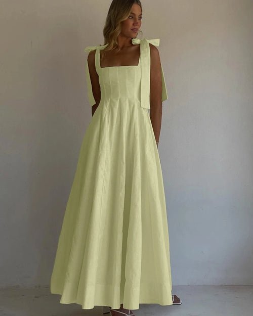 Cotton square neck maxi dress featuring an empire waist, pleated A-line skirt, and sleeveless cut.