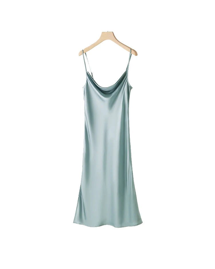 100% mulberry silk spaghetti strap midi dress with dropped collar & ruffle detail. Straight silhouette in 5 colours for spring and summer.
