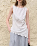 Breathable linen-cotton sleeveless top with asymmetric design. Effortless casual style for summer days, beach outings & holiday escapes.