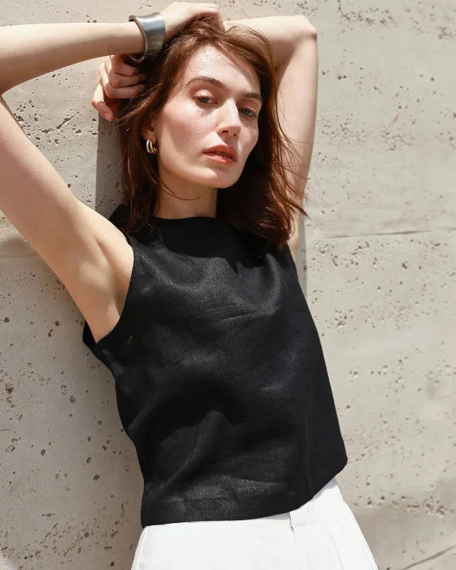 A lightweight pure linen cropped vest featuring a stylish reversible design. This breathable summer vest is made from 100% natural linen, offering a versatile and airy layer perfect for warm weather and creating chic, casual outfits.