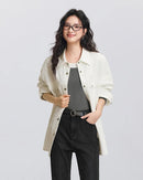 Relaxed mid-length cotton shirt with diamond jacquard texture, dropped shoulders, and buttoned cuffs.
