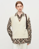 Elegant wool-blend knit vest with a sculpted V-neckline.