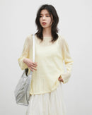 Women's hollow-out slant shoulder knit top with shawl detail, featuring thin acrylic knit and airy drape for spring casual wear or office layering.
