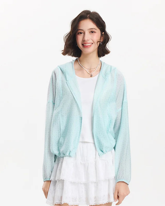 Lightweight Tencel-blend hooded jacket with floral texture, drawstring hem, and elastic cuffs. 

