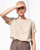 A loose-fit round neck cotton linen t-shirt designed for summer comfort. This lightweight top features a soft blend of breathable cotton and linen, offering a relaxed drape perfect for warm weather.