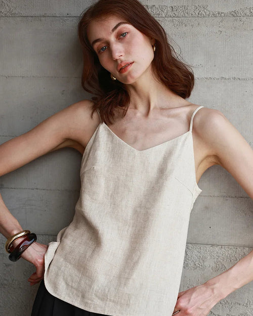 100% linen V-neck camisole with adjustable straps. Lightweight & breathable for effortless summer style, from casual days to beach escapes.