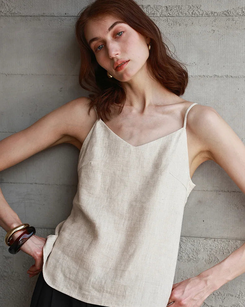 100% linen V-neck camisole with adjustable straps. Lightweight & breathable for effortless summer style, from casual days to beach escapes.