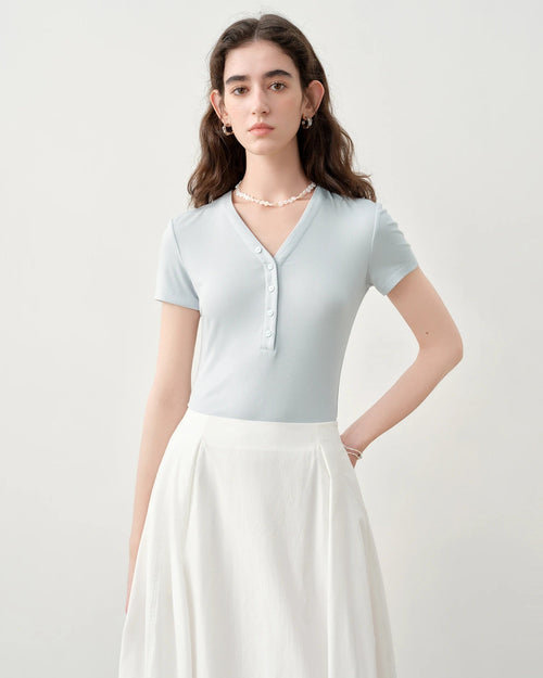 Slim-fit V-neck knit top — crafted from a soft stretch blend for all-day comfort. A refined summer essential for work and weekend wear.
