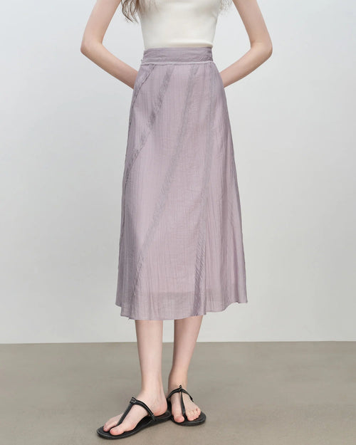 Bias-cut A-line midi skirt — a fluid woven silhouette designed for effortless summer style. Natural waist, mid-calf length. 