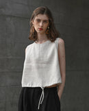 A breathable linen cropped vest featuring a classic crew neck and adjustable drawstring. This lightweight summer top offers a relaxed fit and airy texture, perfect for staying cool in warm weather.
