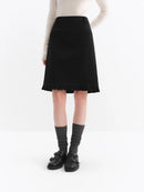Elegant black A-line midi skirt with ruffled hem. Flattering knee-length silhouette in breathable blended fabric. Perfect for office and everyday wear.