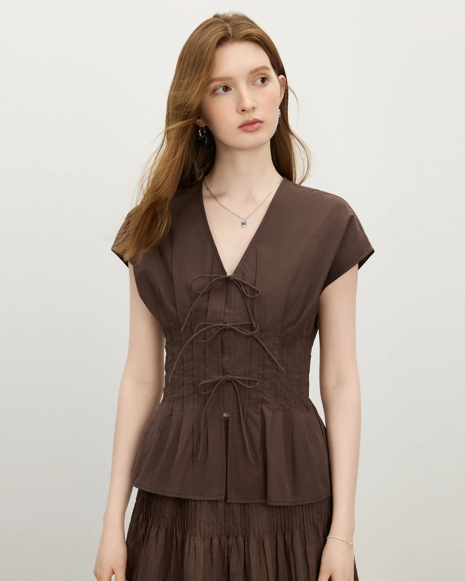 Lightweight cotton women's blouse with open-stitch V-neckline & short sleeves. Relaxed straight cut flows effortlessly from morning errands to summer evenings.