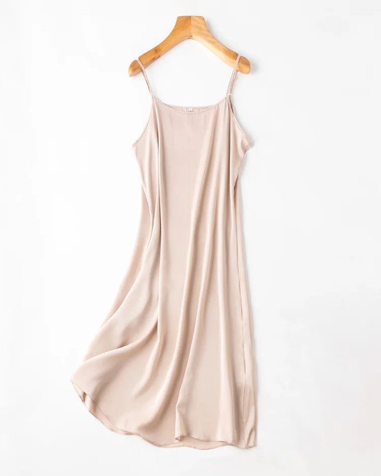 93% mulberry silk & 7% spandex spaghetti strap knee dress. Fluid silk drape with a comfortable stretch, 11 colours, sizes M–XXXL.