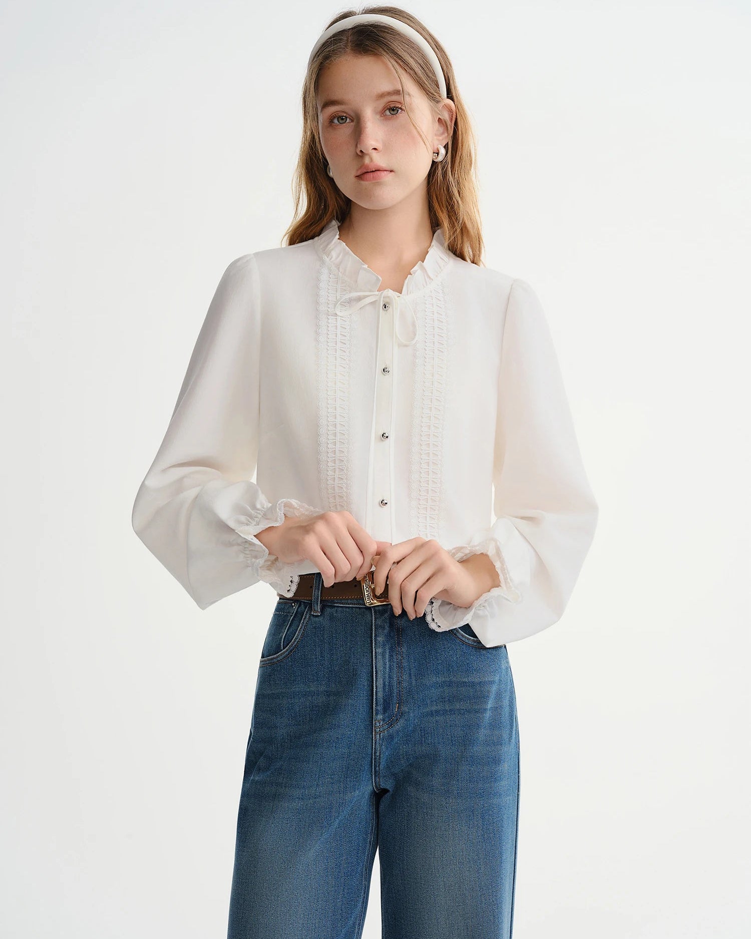 French-style viscose blouse with butterfly sleeves, half-high collar & tie-front detail. Flattering, loose fit for effortless autumn-winter elegance.