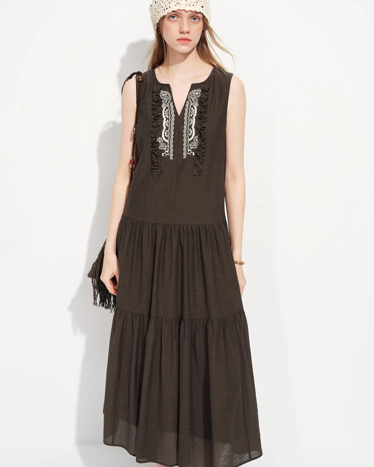 V-neck A-line maxi dress featuring an empire waist and full-length flowy silhouette. Crafted from a soft viscose polyester blend, this elegant long dress offers a flattering drape perfect for vacation and coastal summer wear.