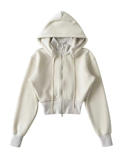 Women's Zip-up cropped sport jacket featuring a detachable hood, double zipper closure, and medium-weight knit polyester fabric, perfect for delivering sporty chic style in air-conditioned studios or city streets.