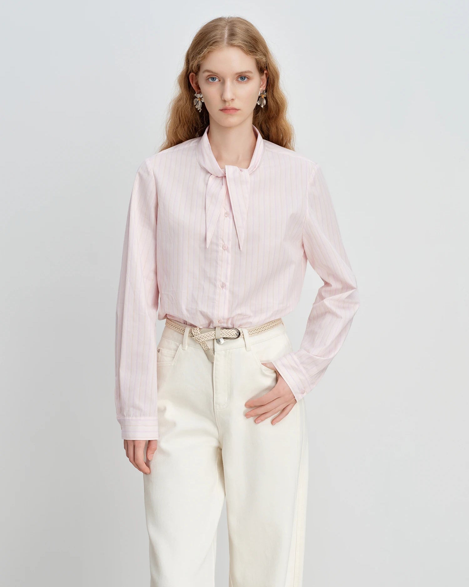 Women's pink striped cotton bunny-tie collar shirt, featuring 100% cotton breathability and playful Korean-inspired charm for effortless spring casual wear or office commutes.