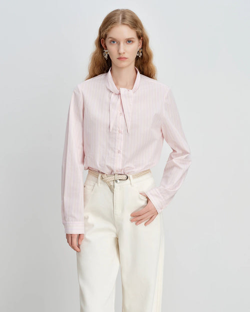 Women's pink striped cotton bunny-tie collar shirt, featuring 100% cotton breathability and playful Korean-inspired charm for effortless spring casual wear or office commutes.