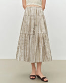 Women's apricot flowy A-line midi skirt, featuring a breathable viscose-lyocell blend and paisley print for effortless bohemian resort charm or beach mornings.